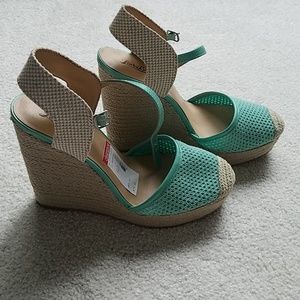 36. Teal and tan closed toe wedges